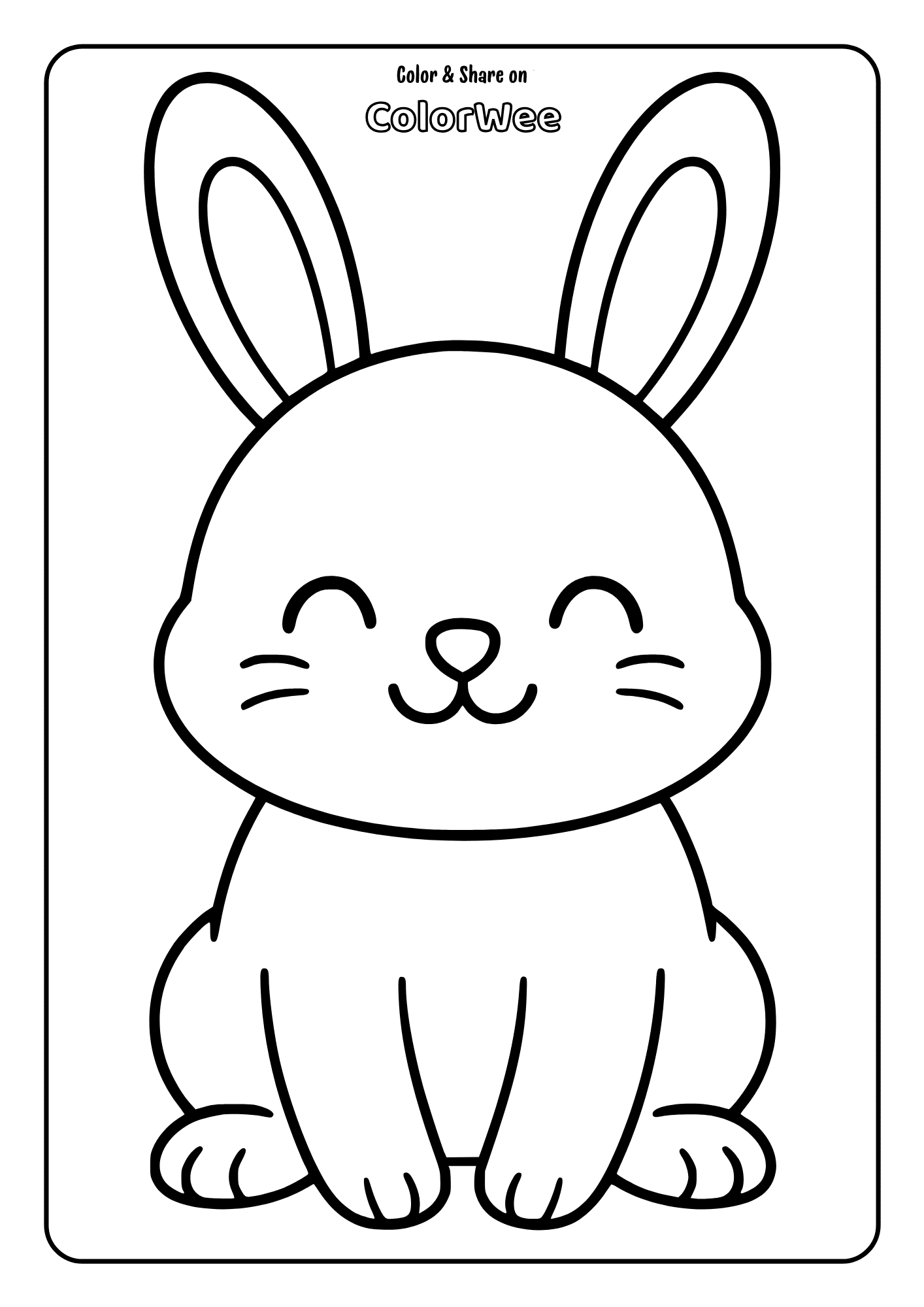 Baby bunny sitting and smiling at the same time.